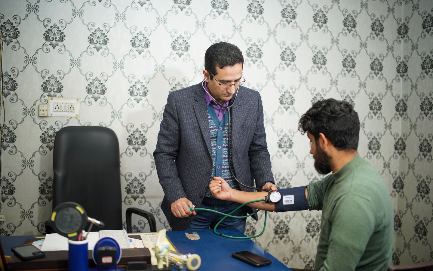 Healthcare professional consulting with a patient in a clinic