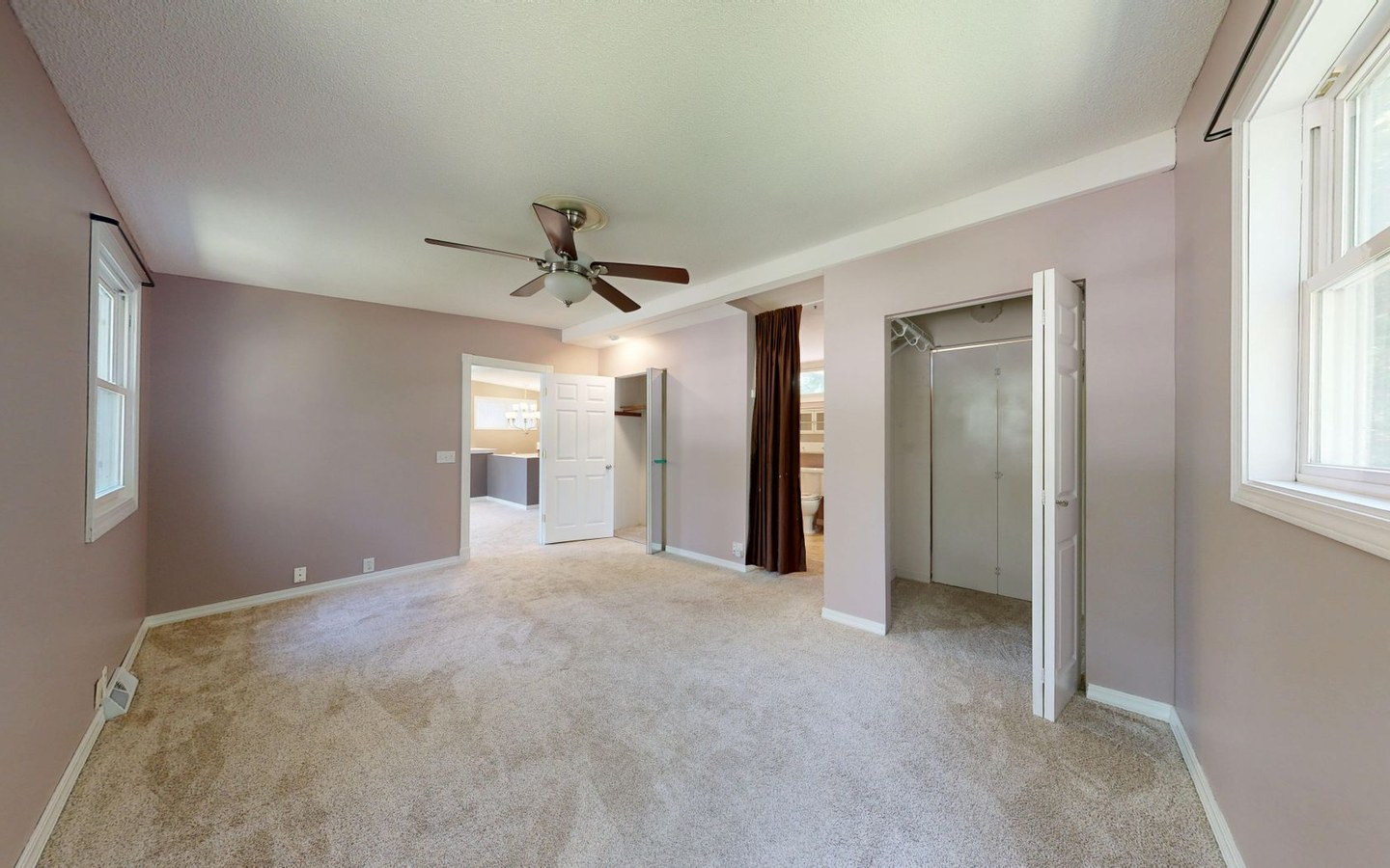 Person taking an interior room photo on a smartphone