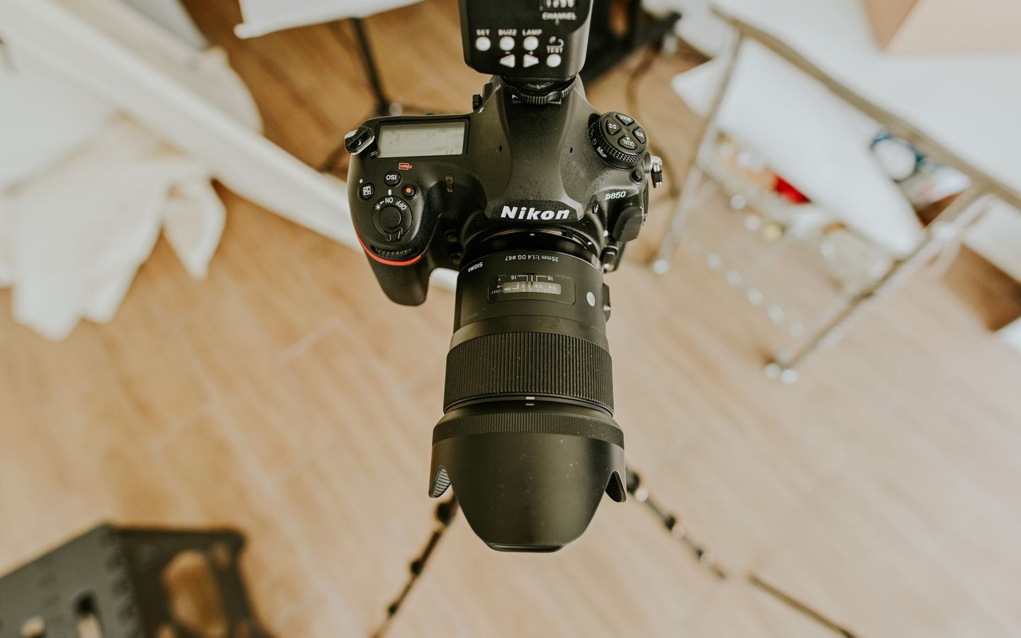 Property photographer with camera in a staged interior